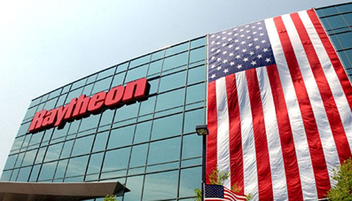 Raytheon building with American flag